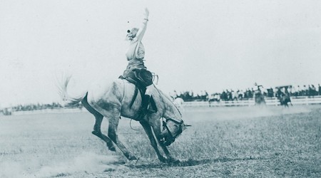 Person riding a bucking horse